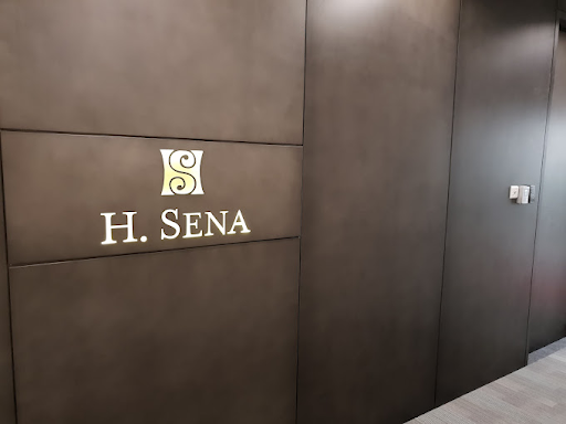 H. Sena logo and typeface on a wall
