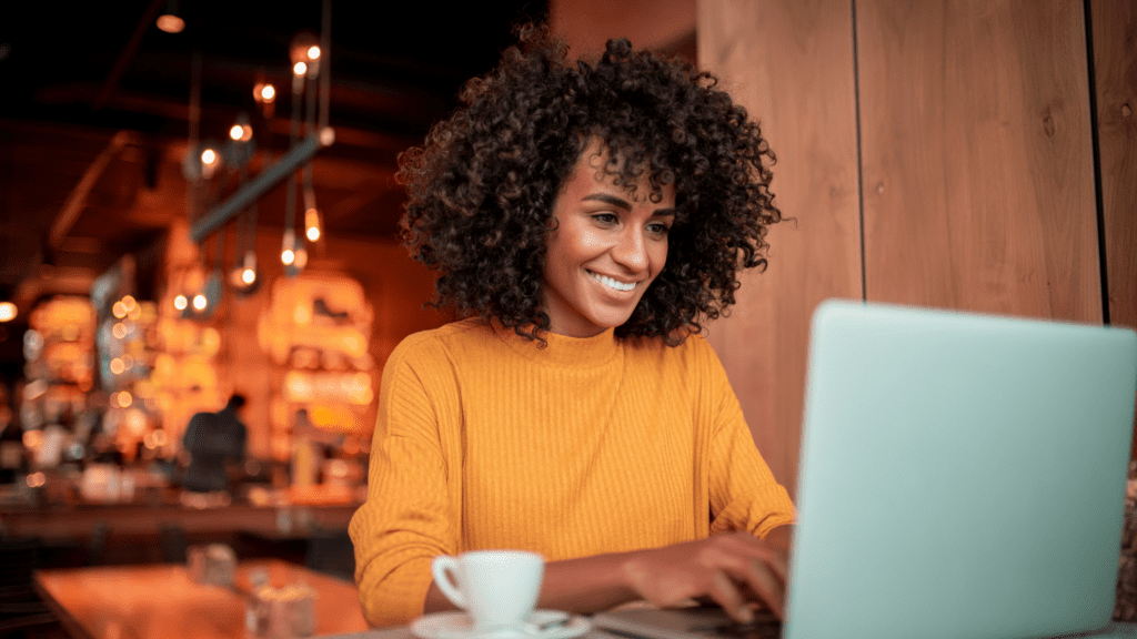 Woman smiling at her laptop