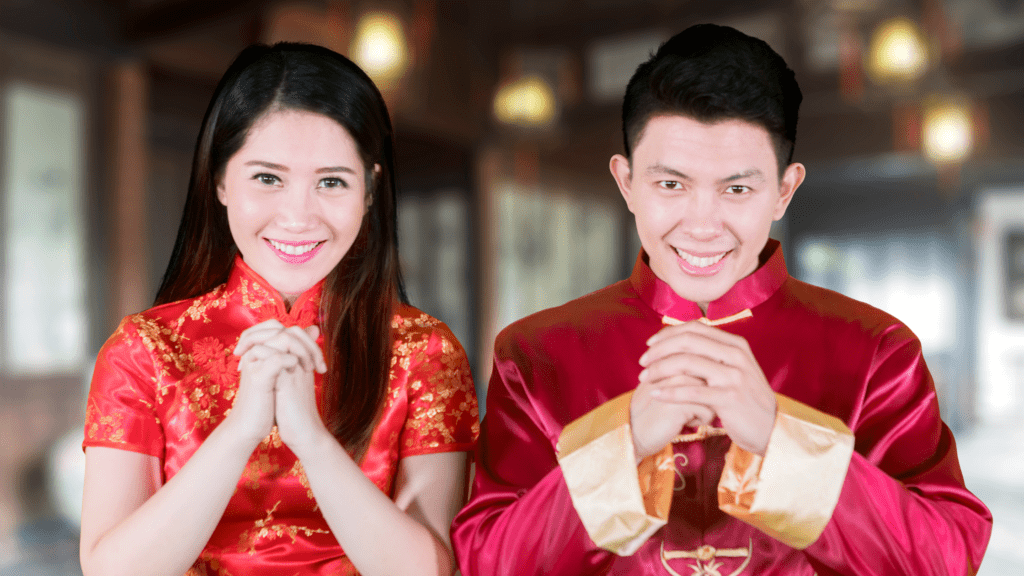 Asian couple in red and gold