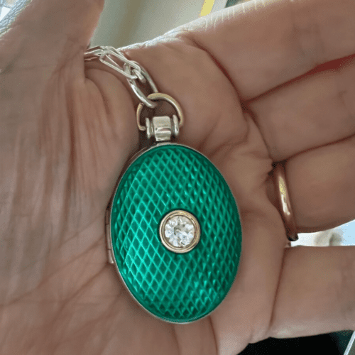 Green enamel locked with diamond center stone
