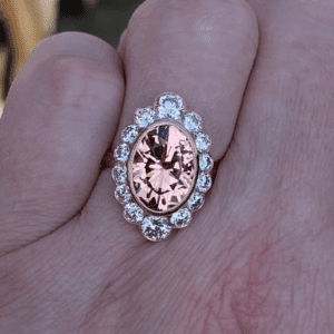 Mahenge garnet surrounded by lab-grown diamonds set in rose gold ring