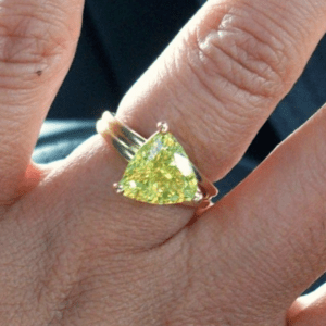 Yellow/Green stone set in gold ring