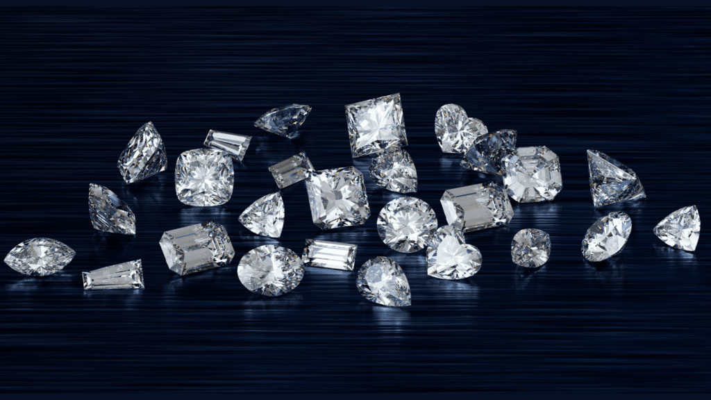 Many diamonds on a blue and black background, varying diamond cuts and styles.