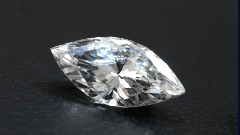 Marquise shaped diamond on black background.