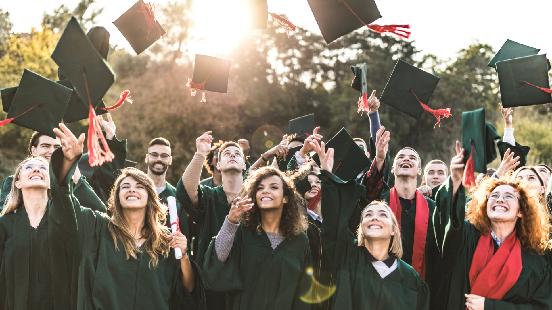 graduates throwing their hats in the air