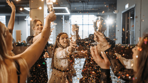 People toasting and celebrating a proposal.