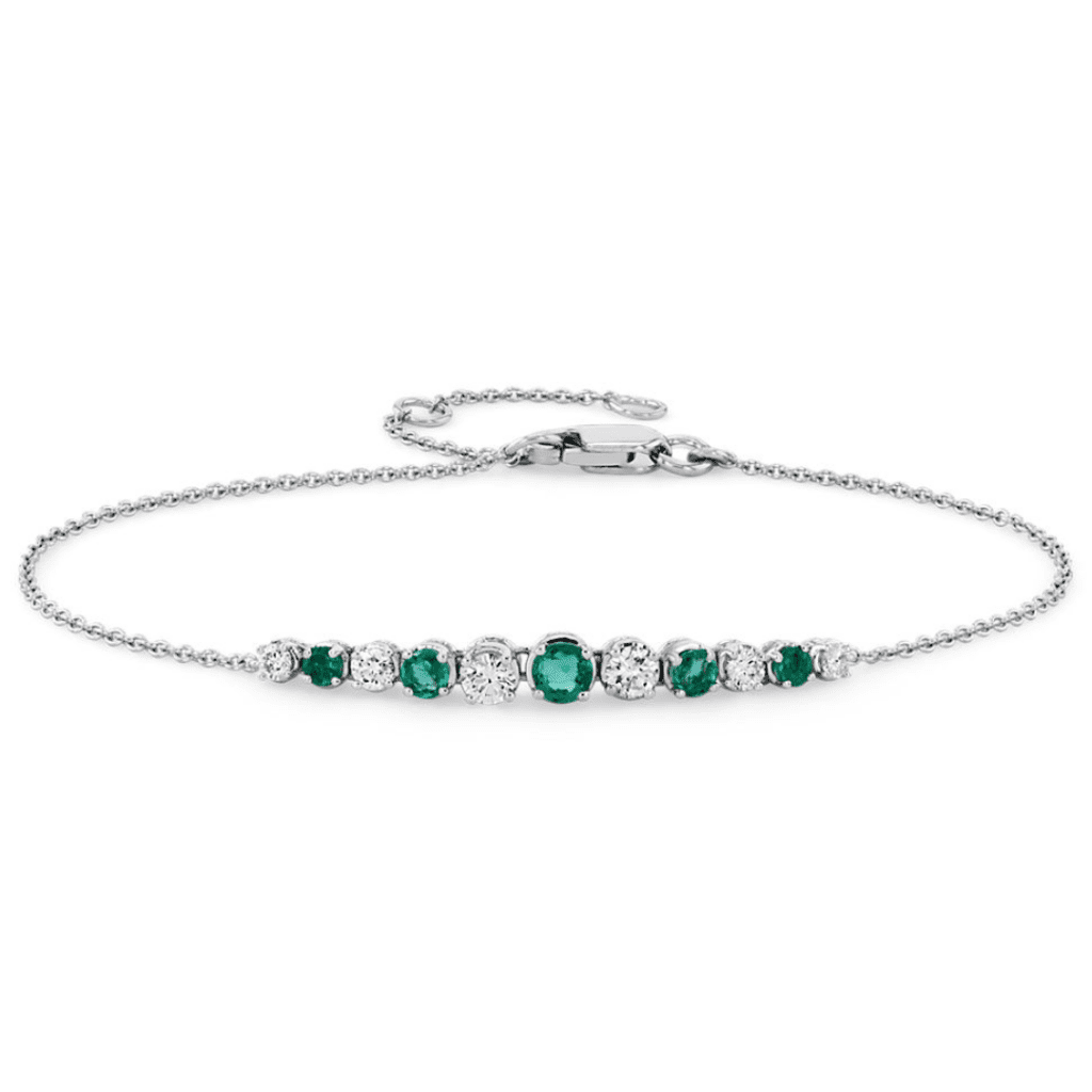 Emerald and Diamond Graduated Curve Bracelet from Blue Nile.