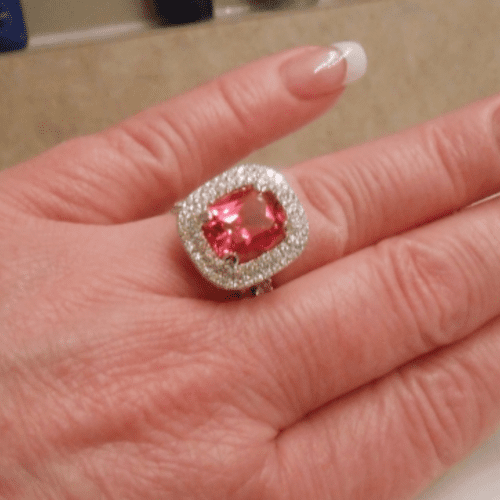 Padparadscha sapphire and diamond ring