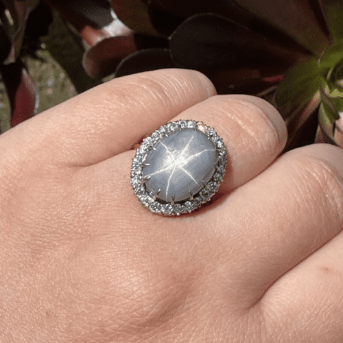Tiffany & Co Star Sapphire ring in an OEC diamond halo
