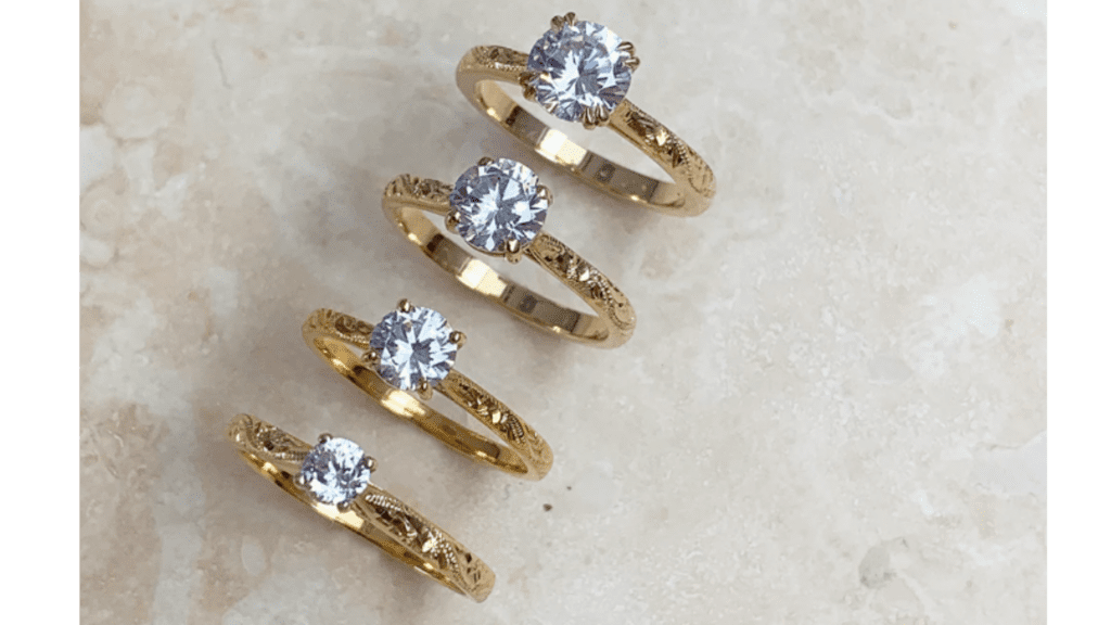 4 Gold Rings with different carat diamonds