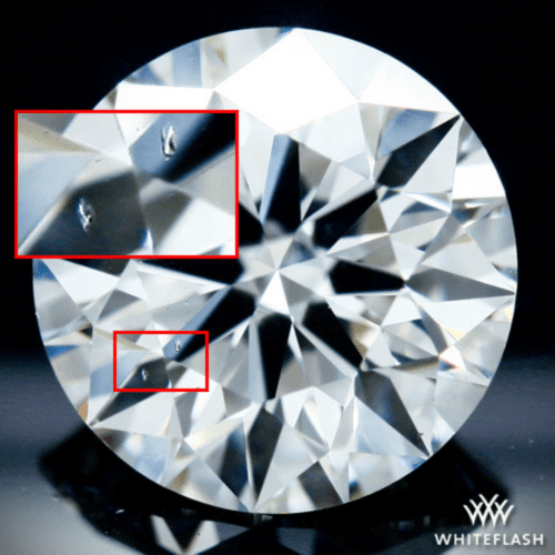 Crystal inclusion under the table that is reflected in the crown facets actual diamond